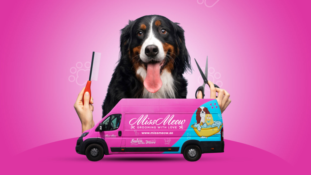 Miss Meow grooming van with a happy dog
